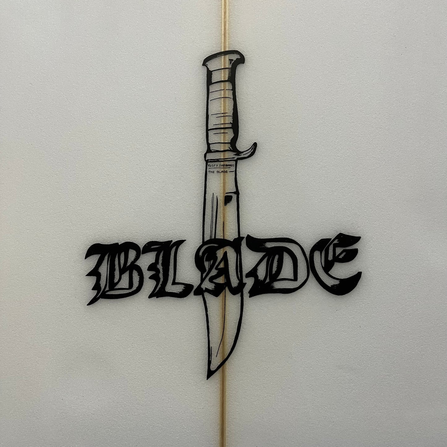 Rusty Blade 5'11" secondhand surfboard model logo close-up