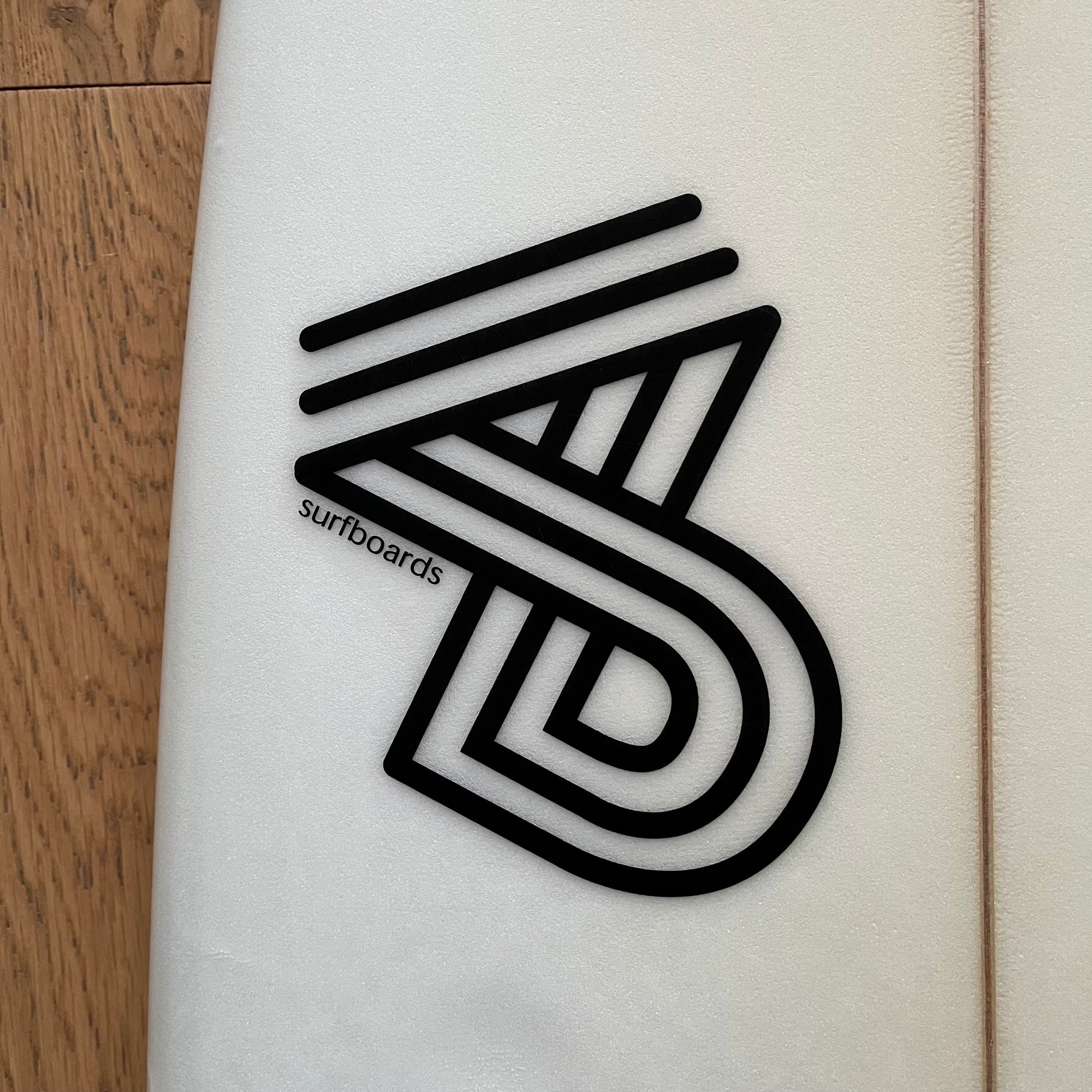 4D Surfboards Two Swords 6'4" secondhand surfboard brand logo close-up