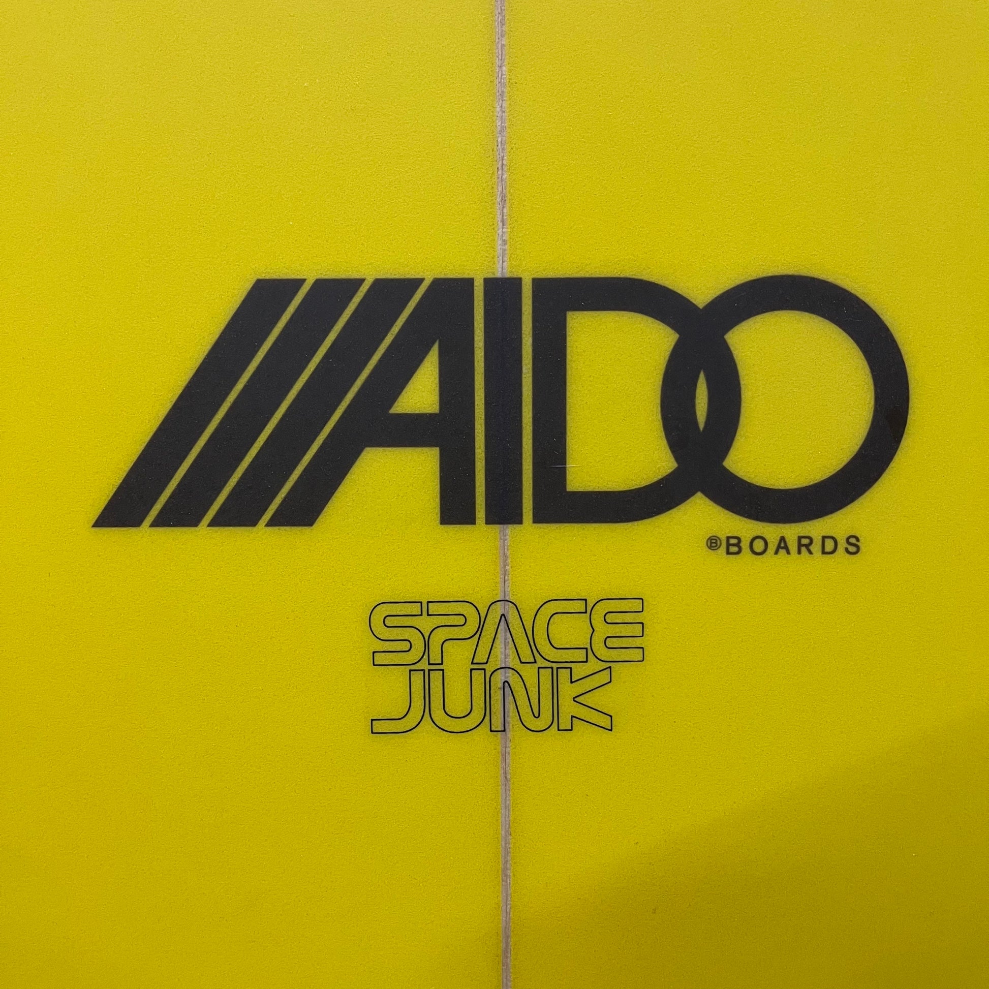 Aido Space Junk 5'10" secondhand surfboard brand logo close-up