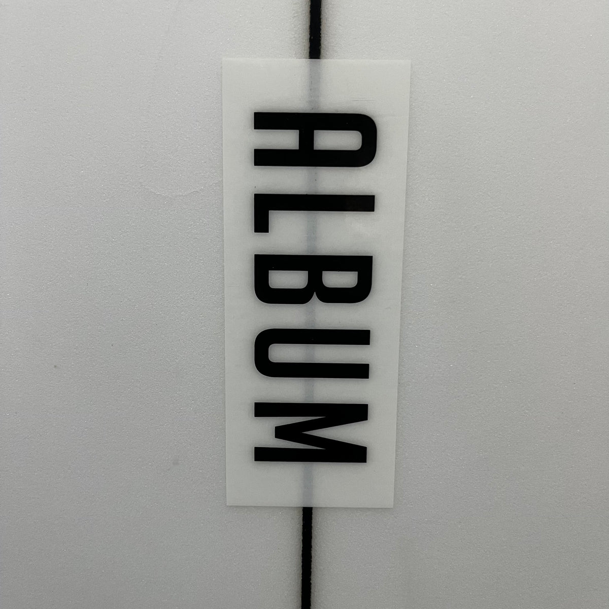 Album Moonstone 6'10" secondhand surfboard brand logo close-up