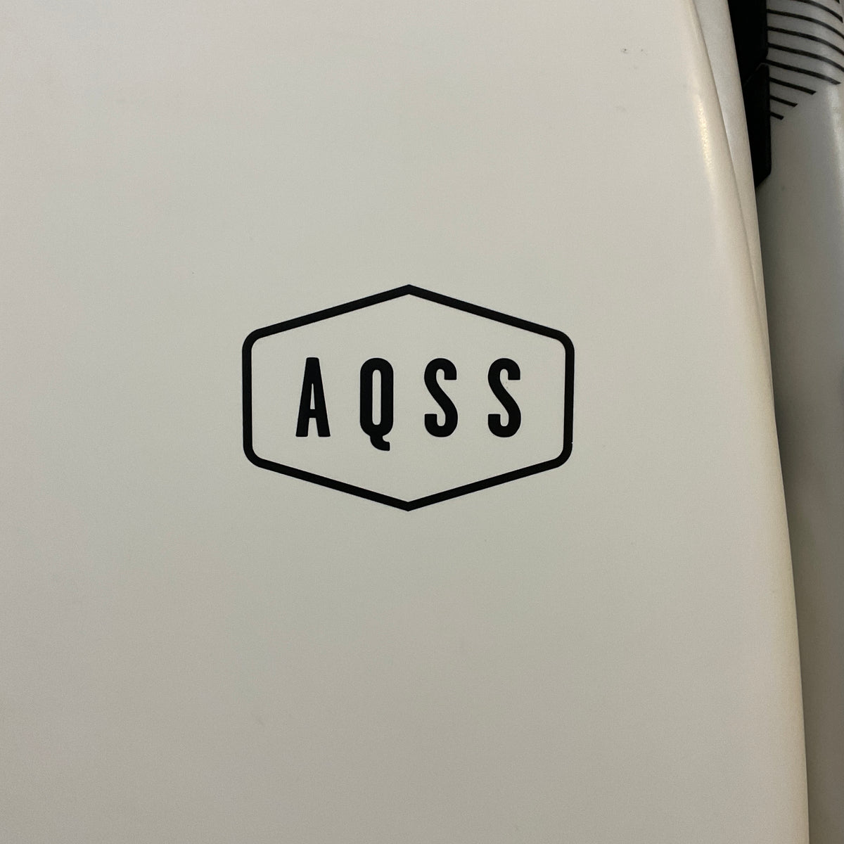AQSS Flying Fish 6'0" secondhand surfboard brand logo close-up