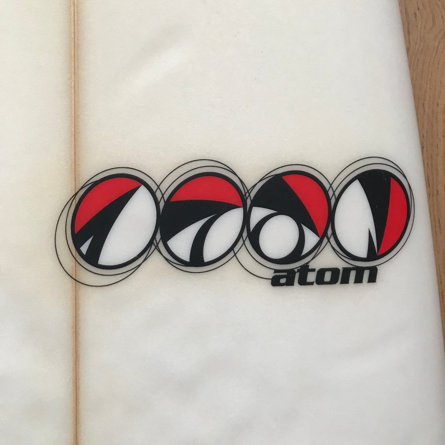 Atom high performance shortboard 6'2" secondhand surfboard brand logo close-up