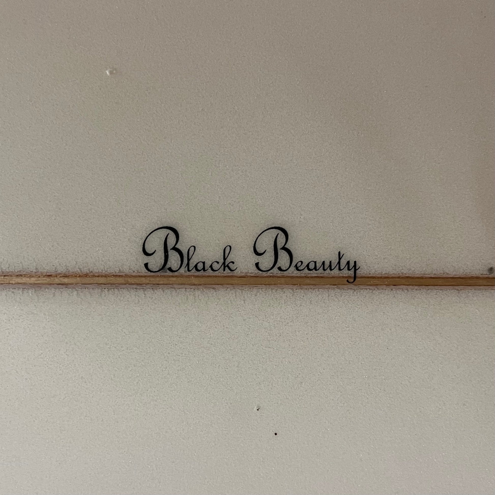 Channel Islands Surfboards Black Beauty 7'0" secondhand surfboard model logo close-up