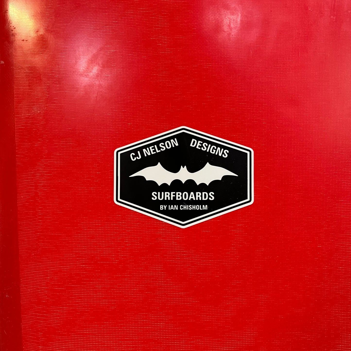 CJ Nelson Designs Surfboards The Sinner Xeon Red 9'2" secondhand surfboard brand logo close-up