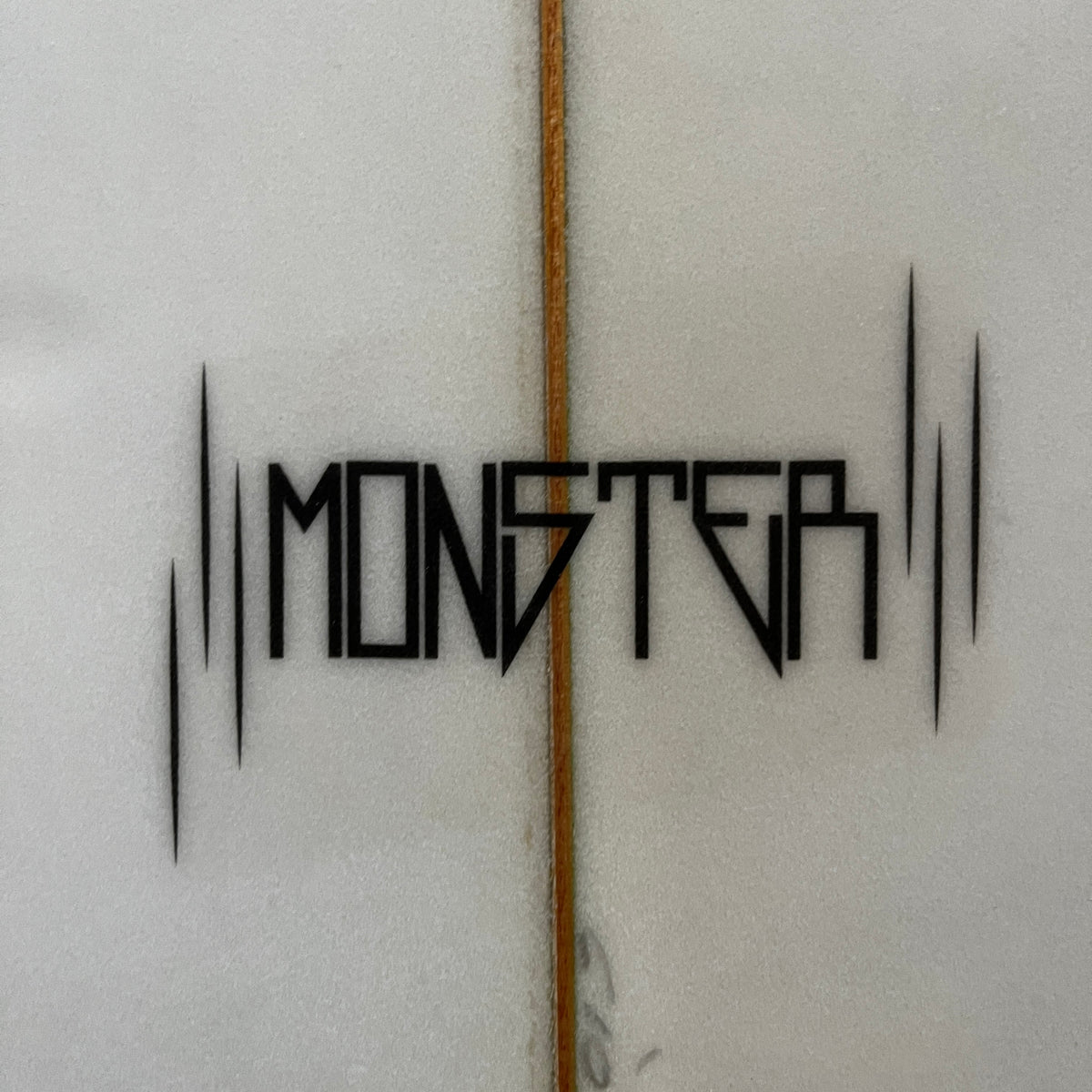 DHD Monster 6'10" secondhand surfboard model logo close-up