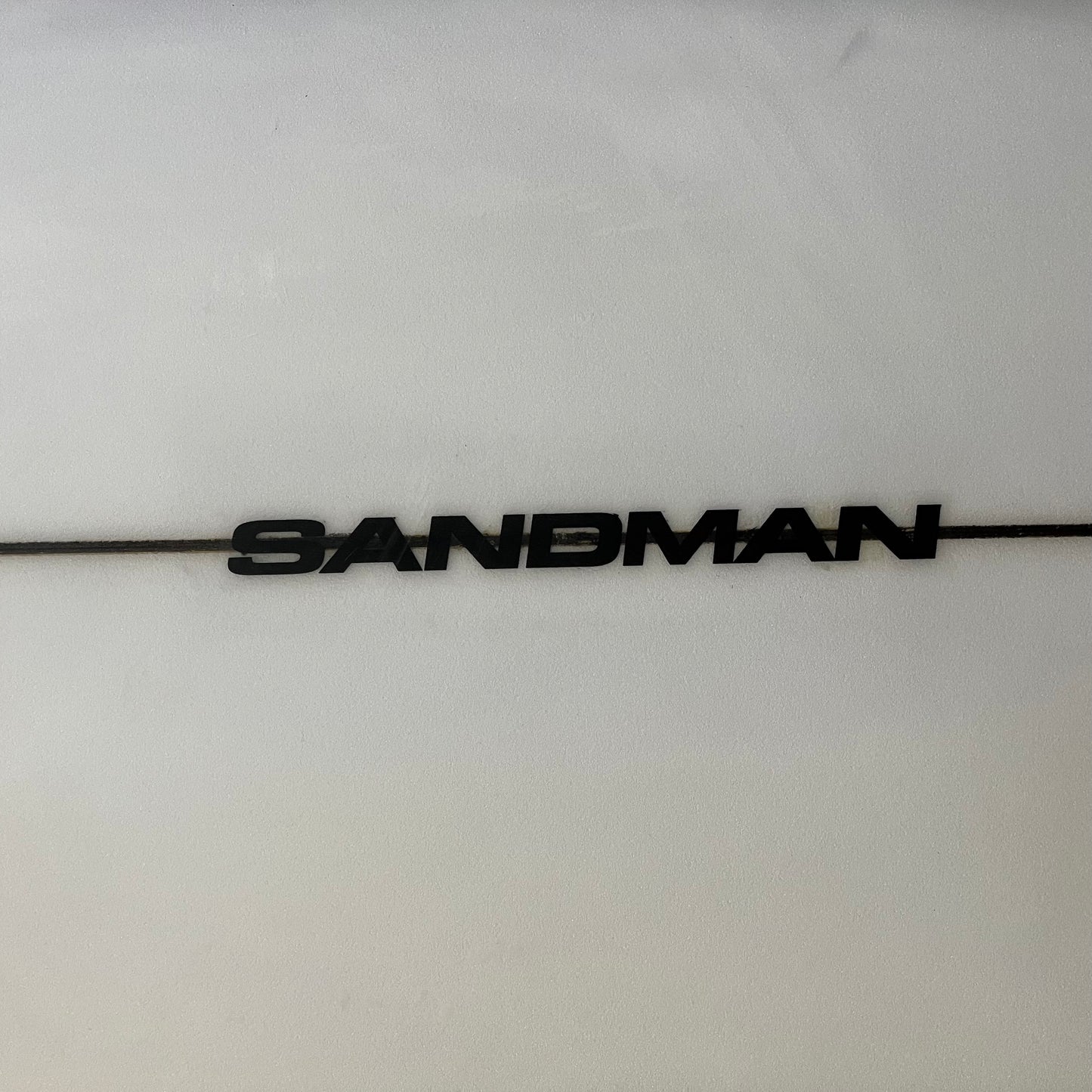 DHD Sandman 6'4" secondhand surfboard model logo close-up