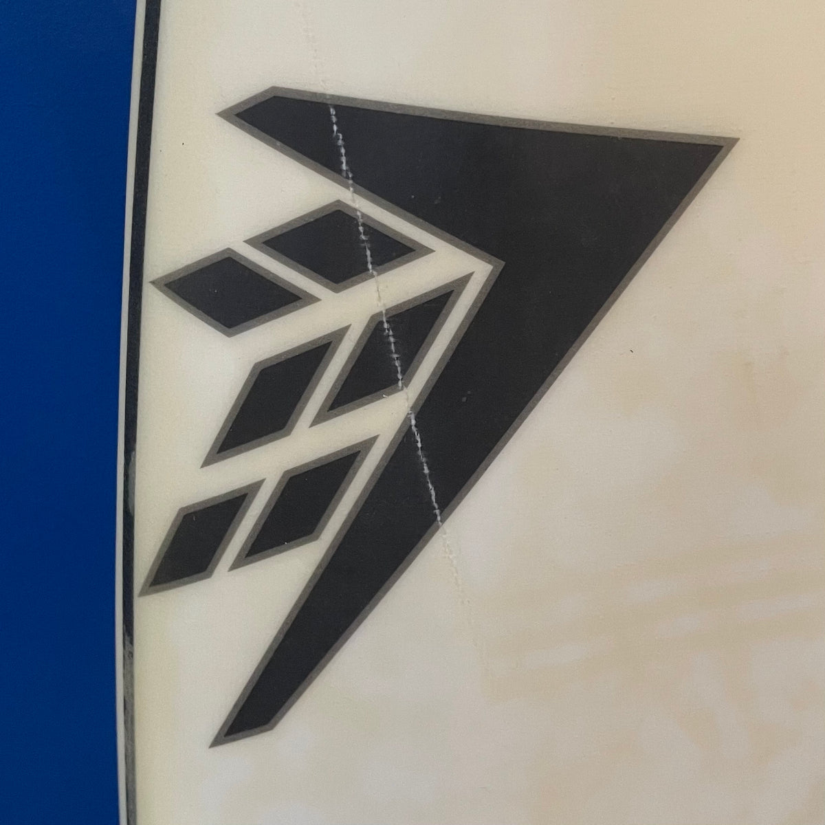Firewire baked potato 5'7" secondhand surfboard brand logo close-up
