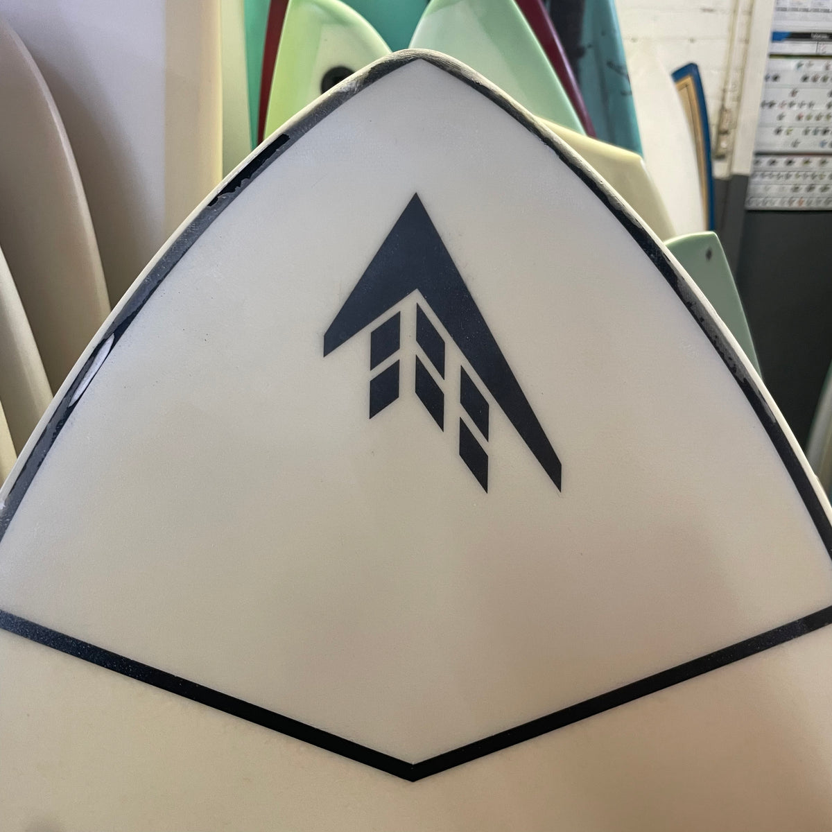 Firewire baked potato 5'7" secondhand surfboard brand logo close-up