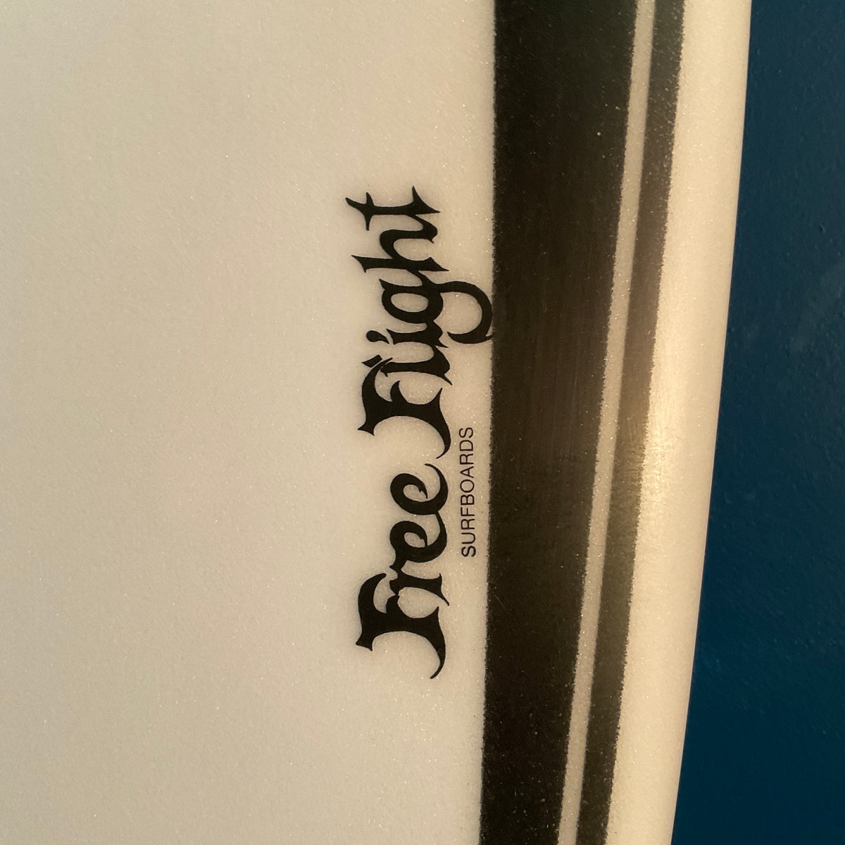 Free Flight Lotus Hybrid 7'4" secondhand surfboards brand logo close-up