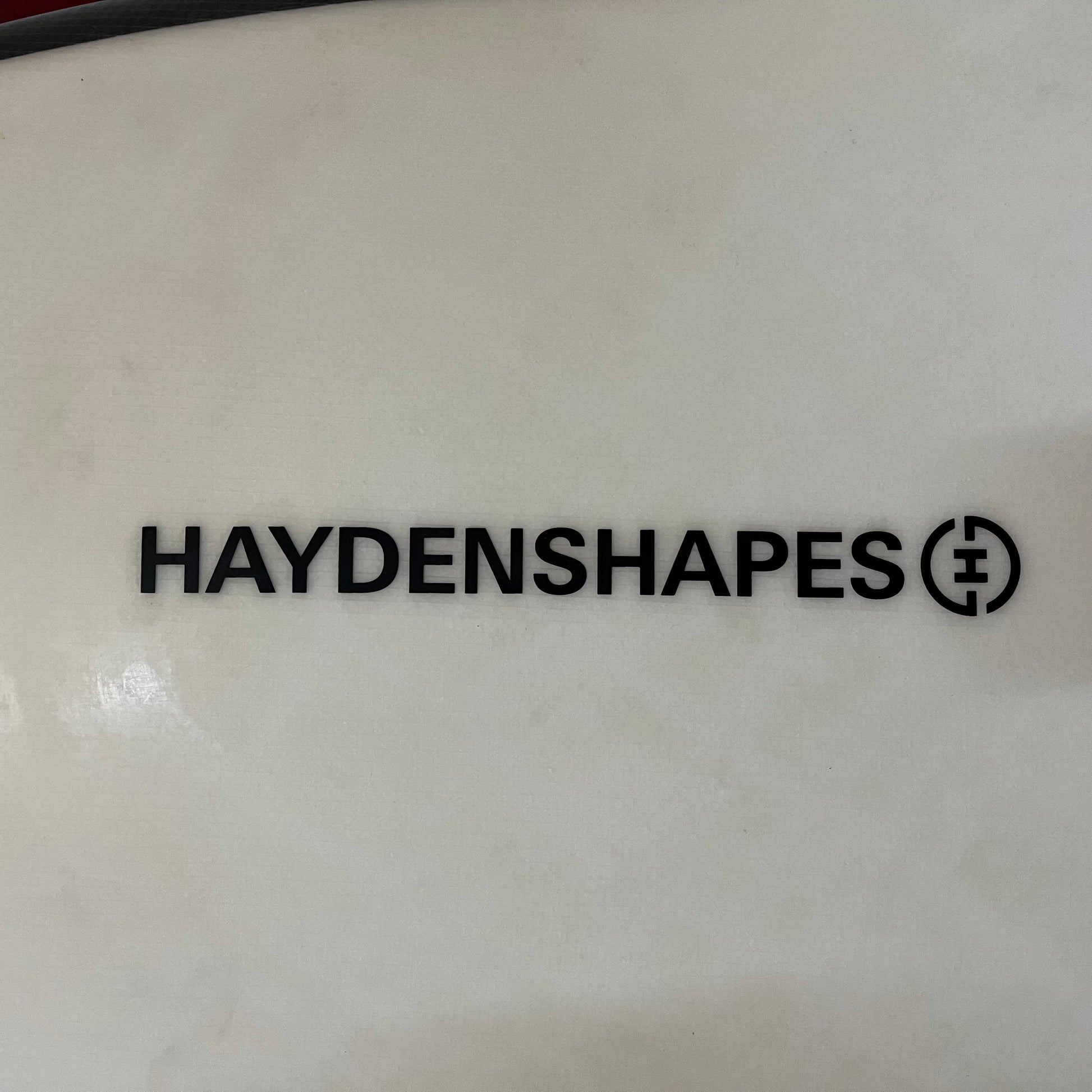 Hayden Shapes Future Flex 5'6" secondhand surfboard brand logo close-up