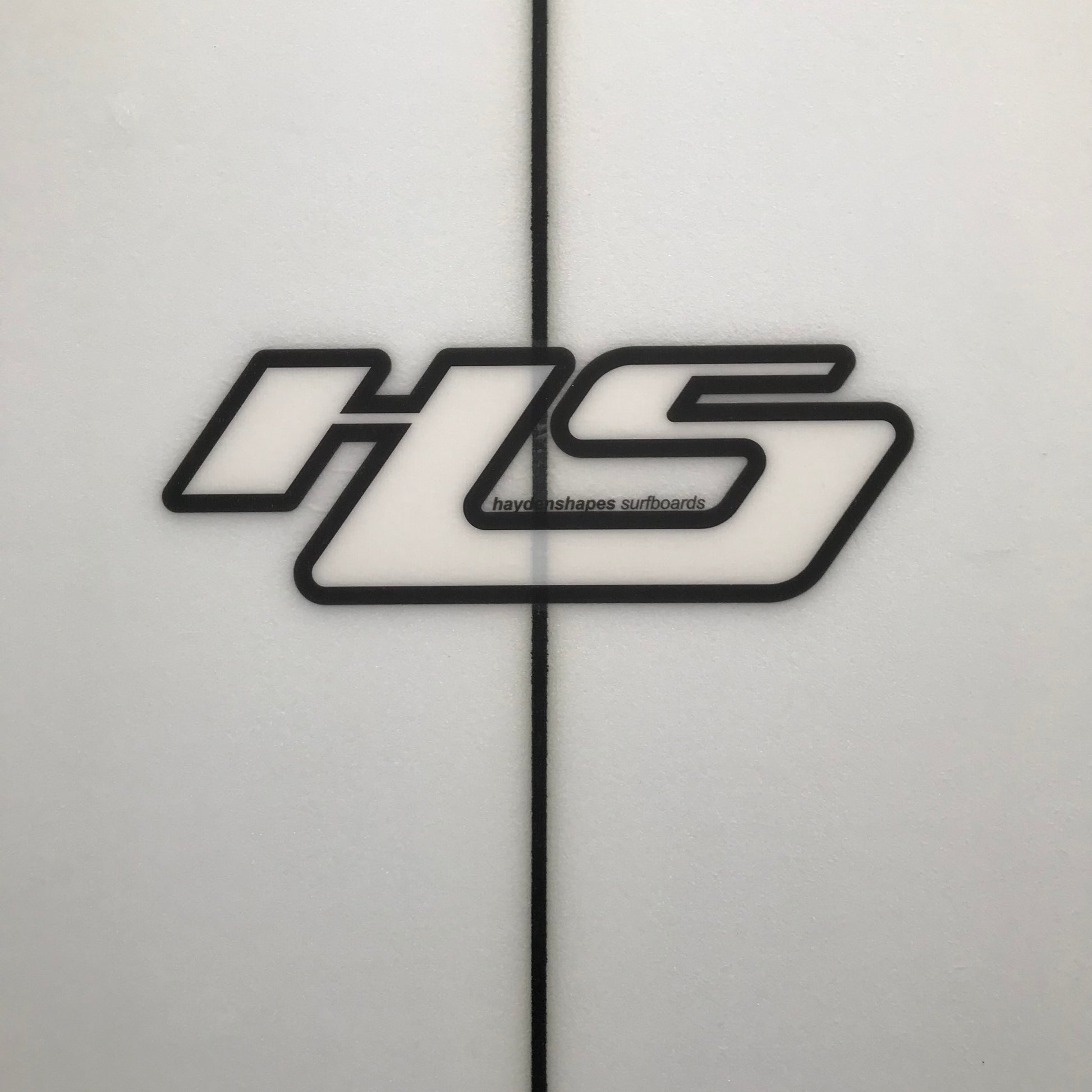 Hayden Shapes Loot 5'10" secondhand surfboard brand logo close-up