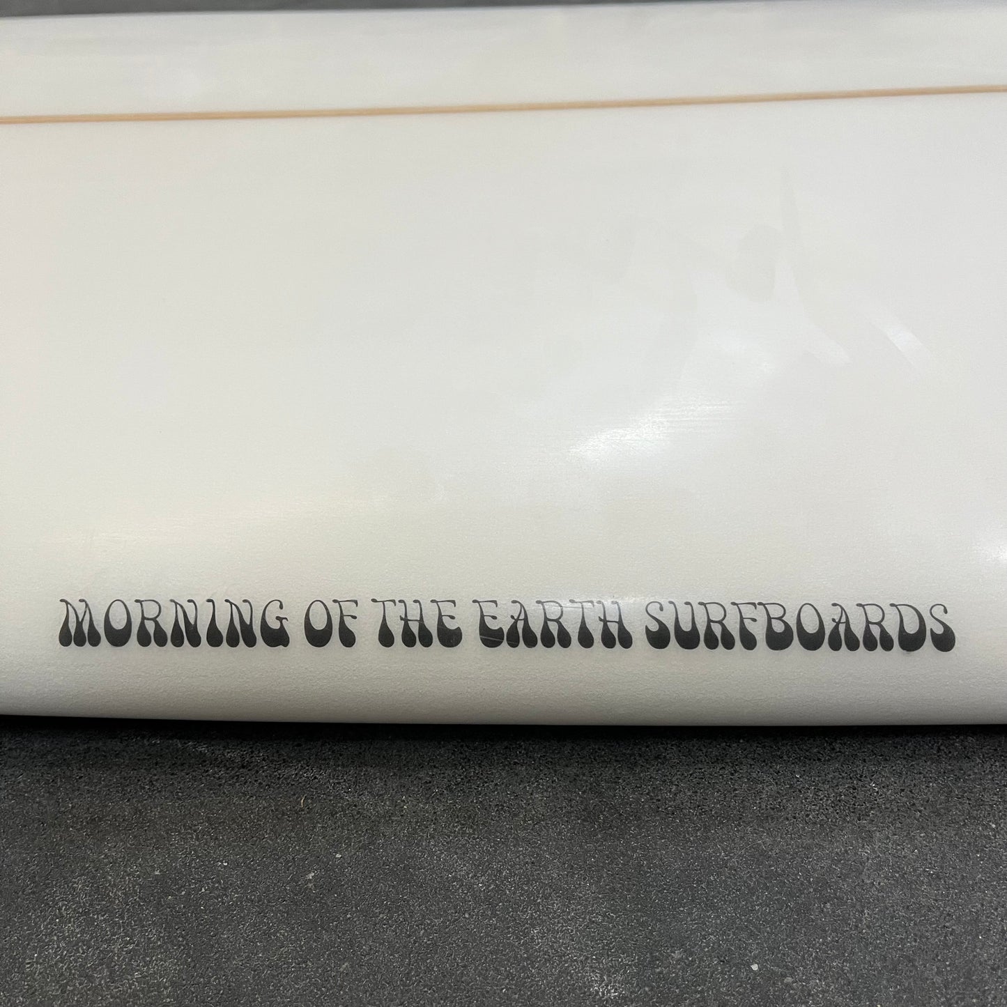 Morning of the Earth Massive 7'10" secondhand surfboard brand logo name close-up