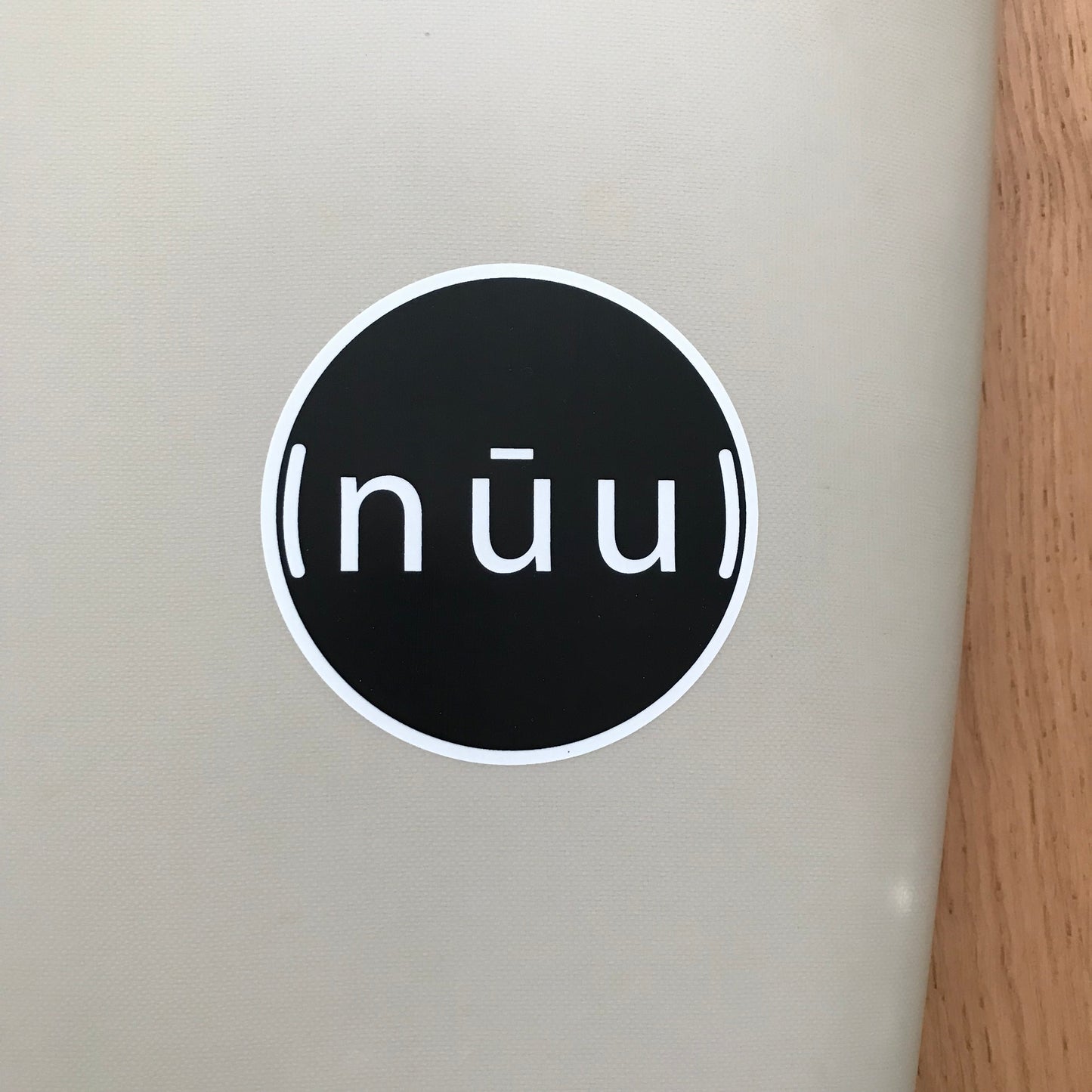 NUU Face Palm 5'10" secondhand surfboard brand logo close-up