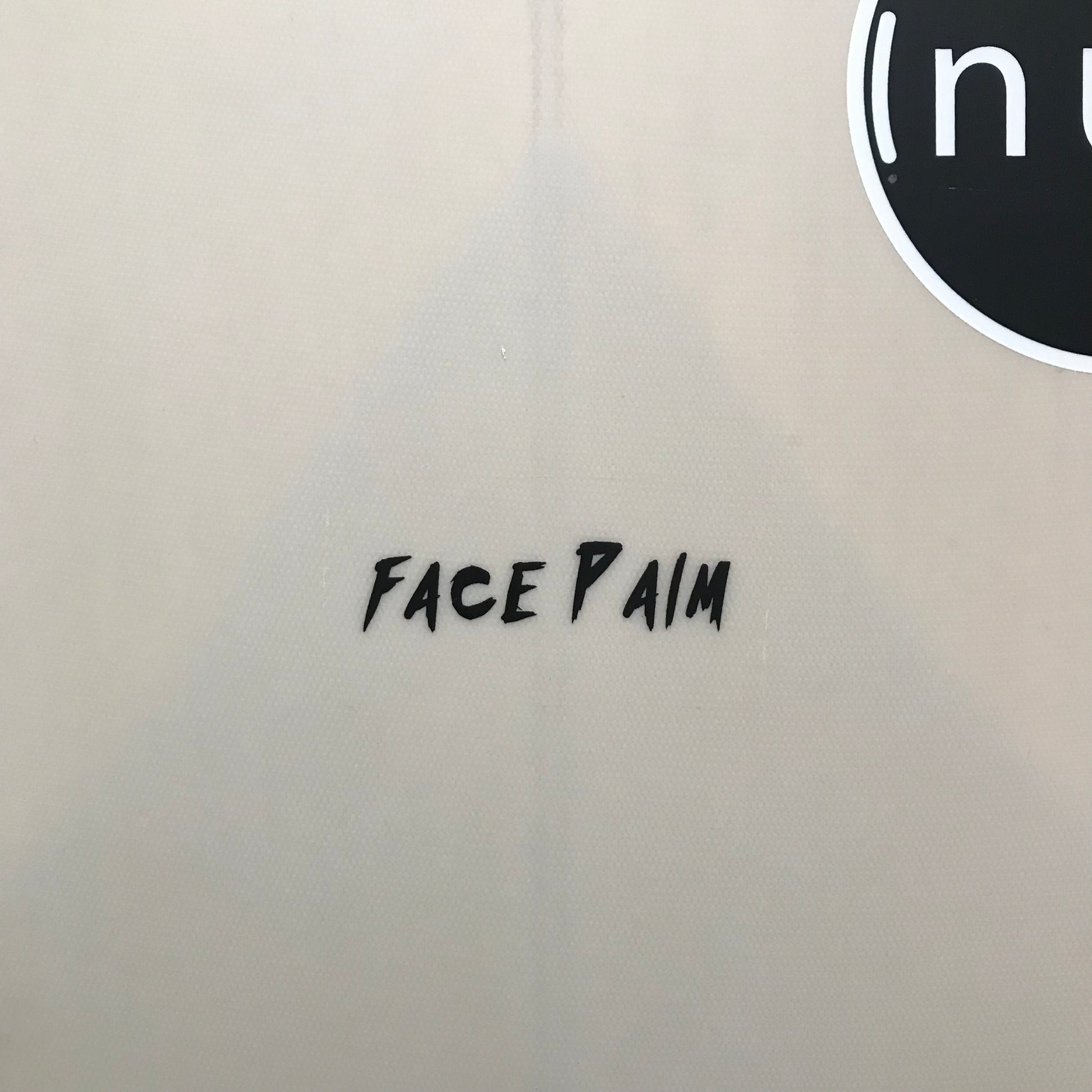 NUU Face Palm 5'10" secondhand surfboard model logo close-up