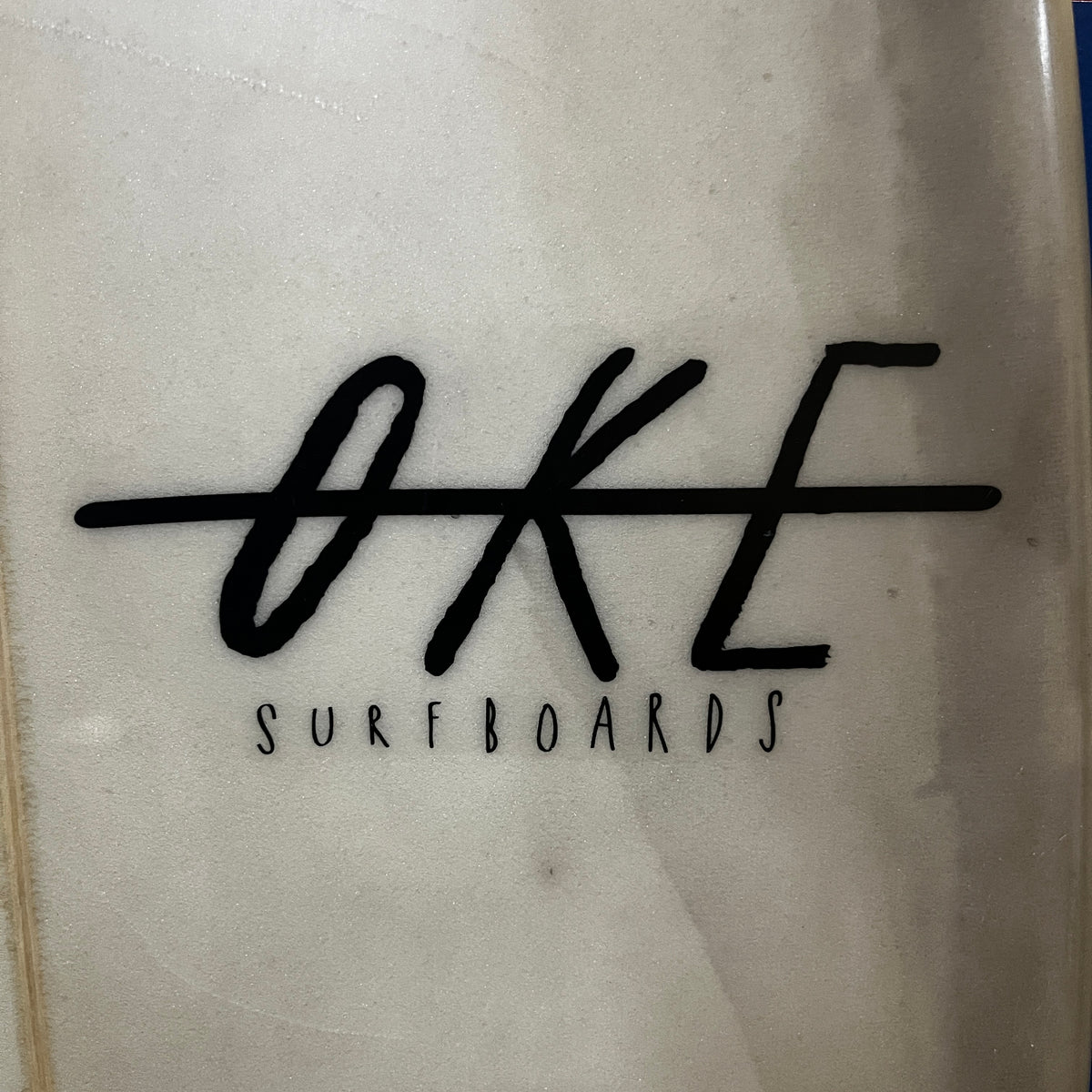 Oke Abalone 5'11" secondhand surfboards brand logo close-up