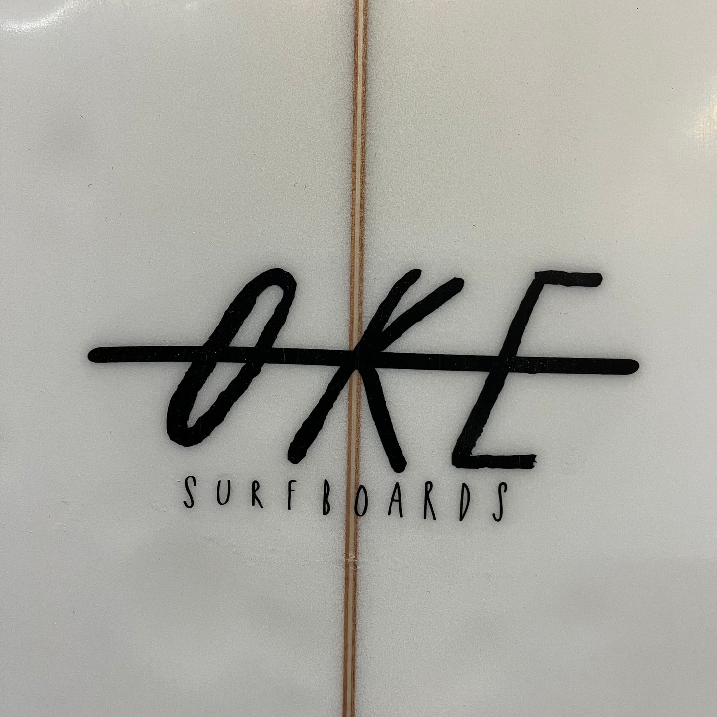 Oke Surfboards Fish 6'6" secondhand surfboard brand logo close-up