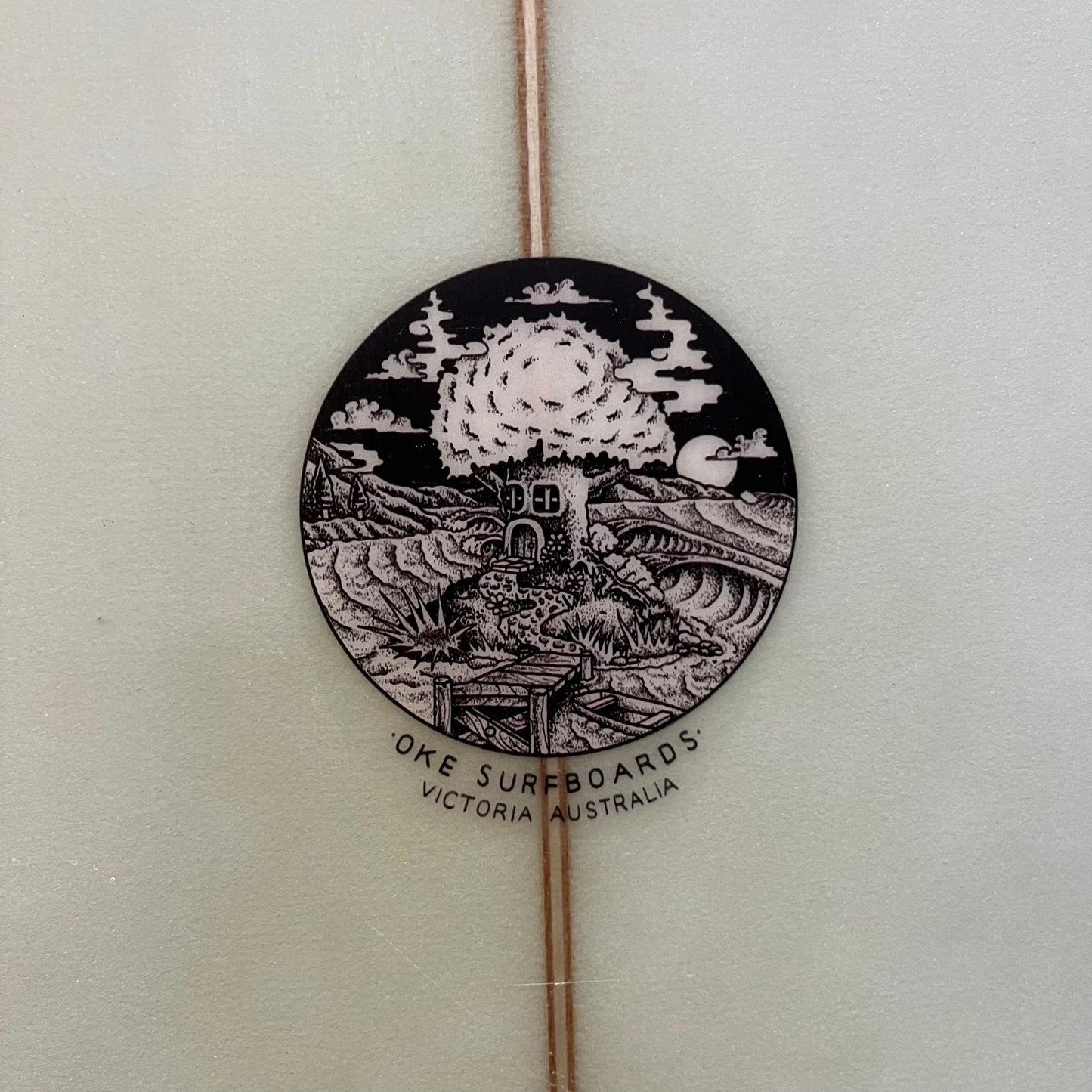 Oke Surfboards mid length 7'10" secondhand surfboard brand logo close-up