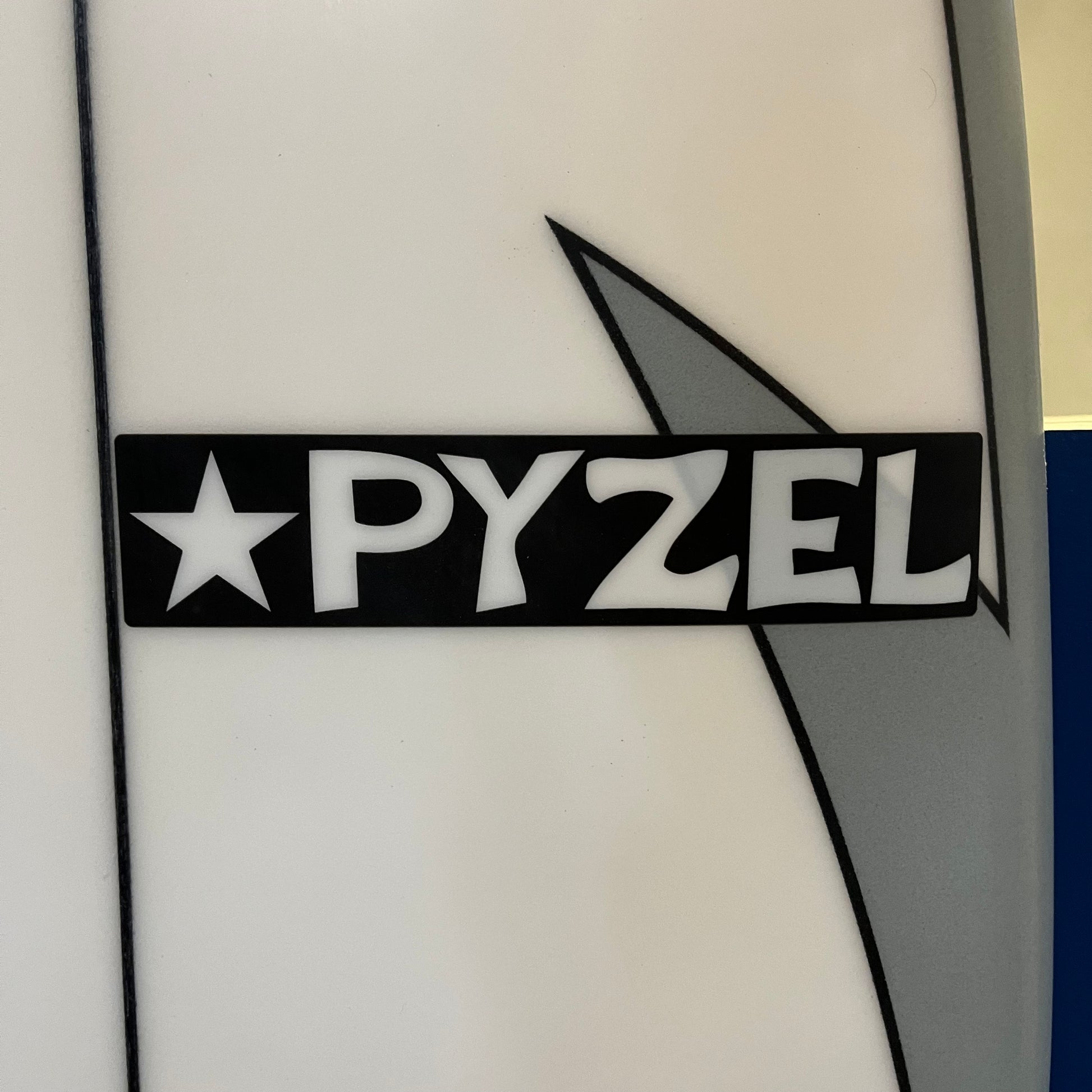 Pyzel Astro Pop 6'4" secondhand surfboard brand logo close-up