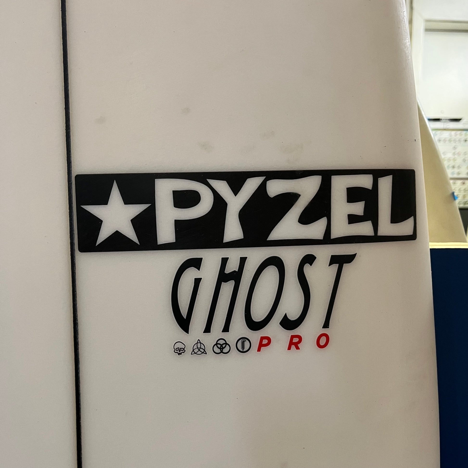 Pyzel Ghost Pro 6'8" secondhand surfboard brand logo close-up