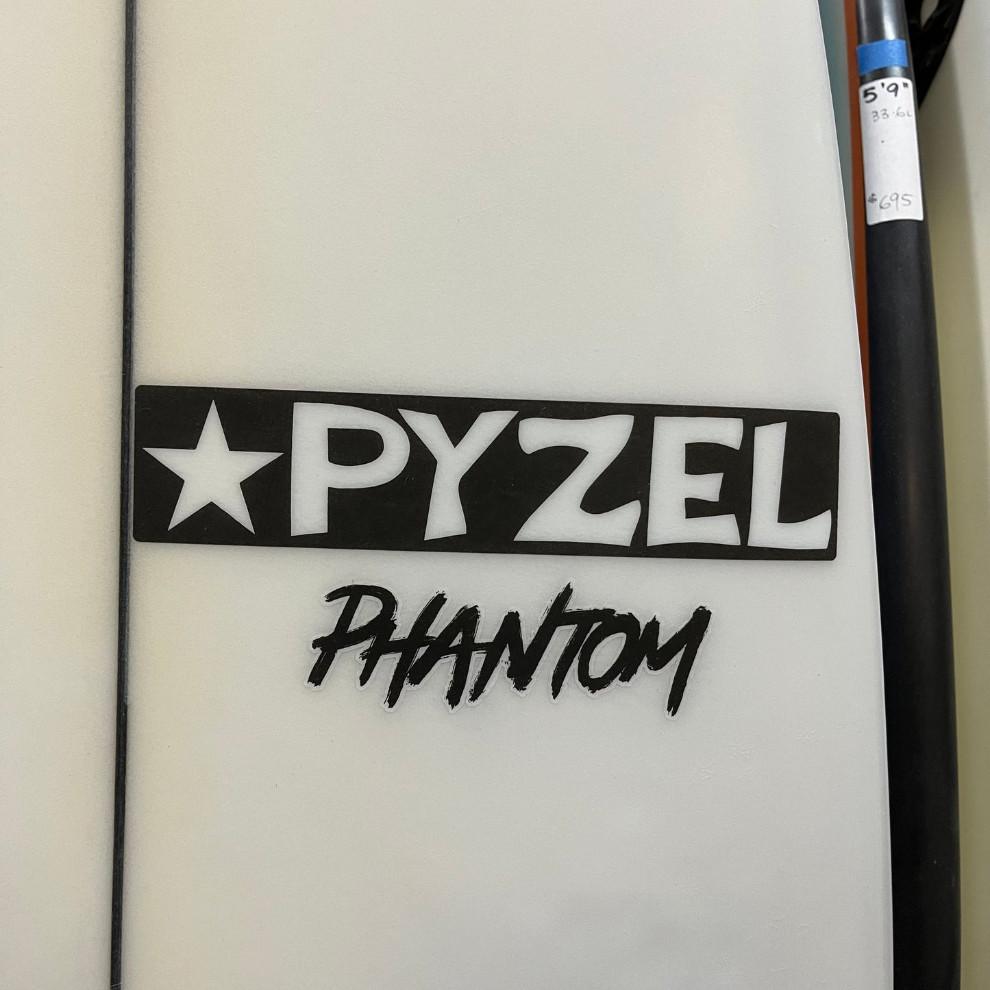 Pyzel Phantom 6'1" secondhand surfboard brand logo close-up