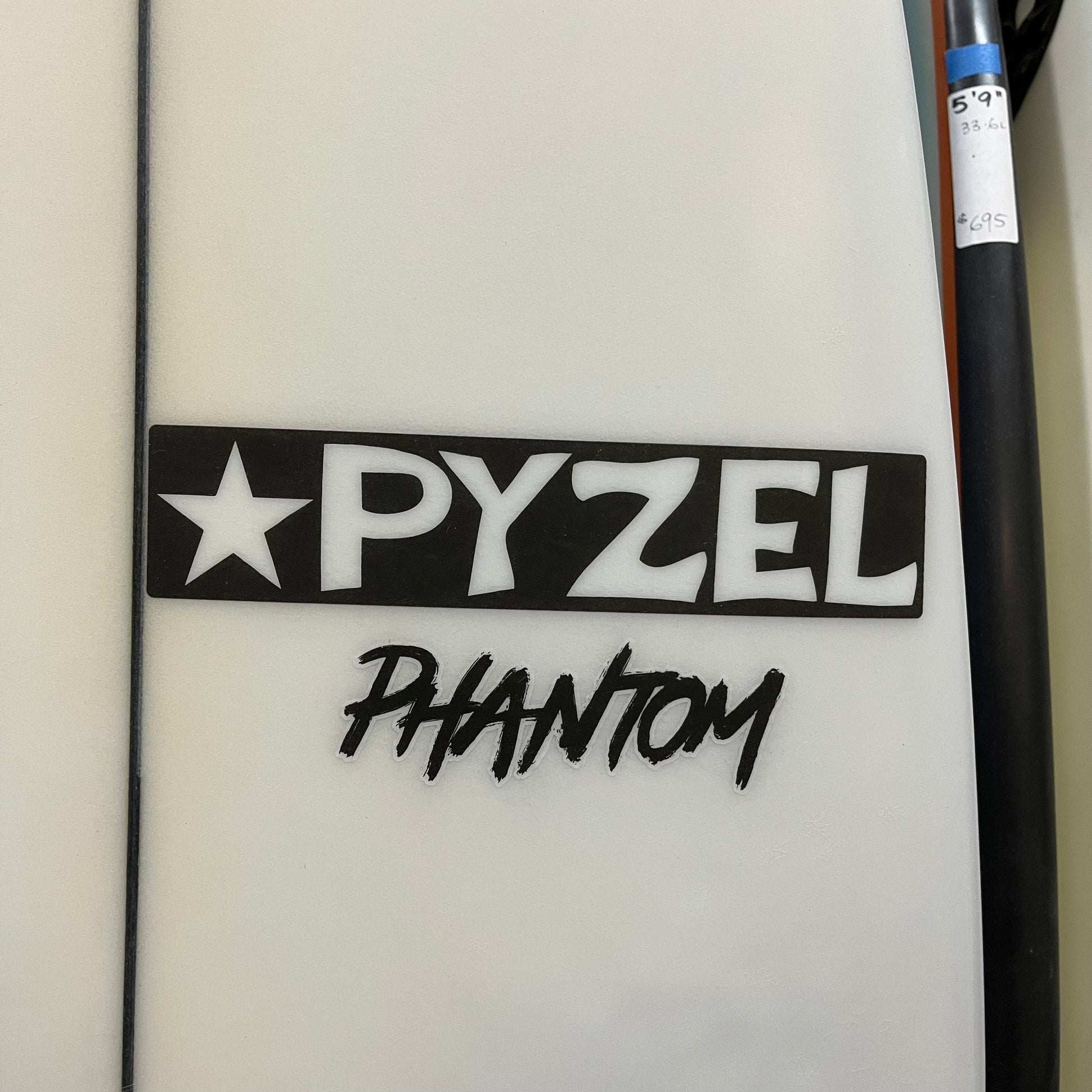 Pyzel Phantom 6'1" secondhand surfboard brand logo close-up