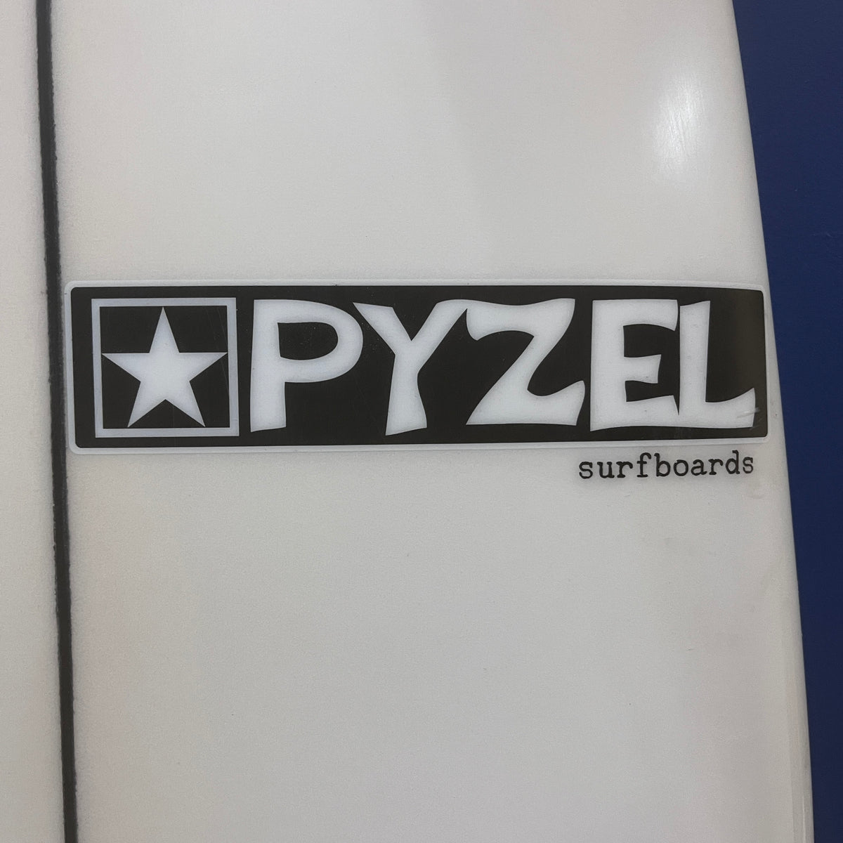 Pyzel Radius 5'11" secondhand surfboard brand logo close-up