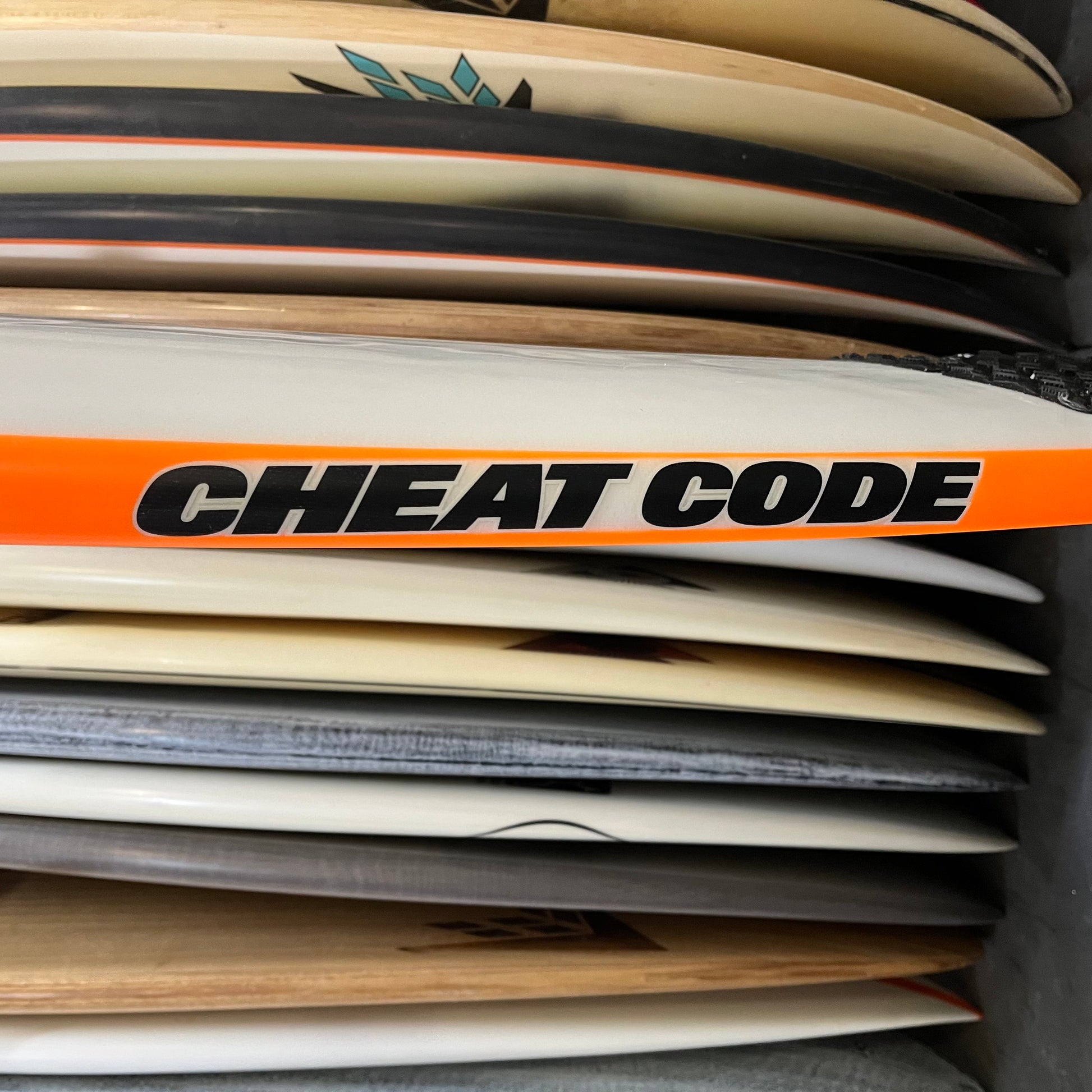 Sharpeye Cheat Code 5'10" secondhand surfboard model logo close-up