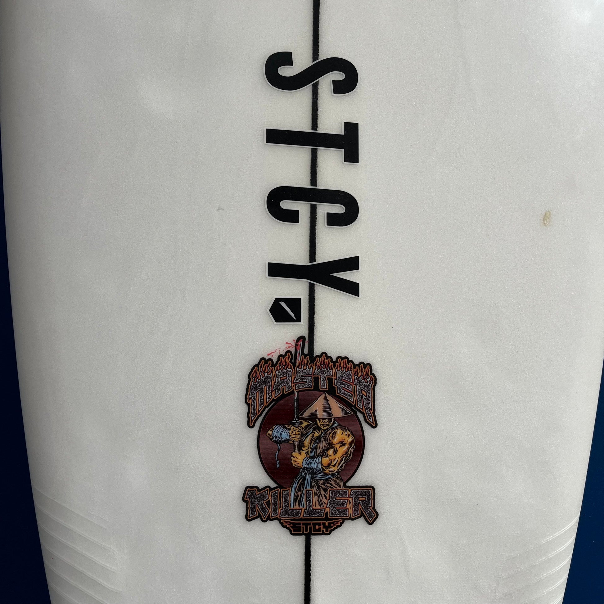 Stacey Master Killer 6'11" secondhand surfboard brand logo close-up