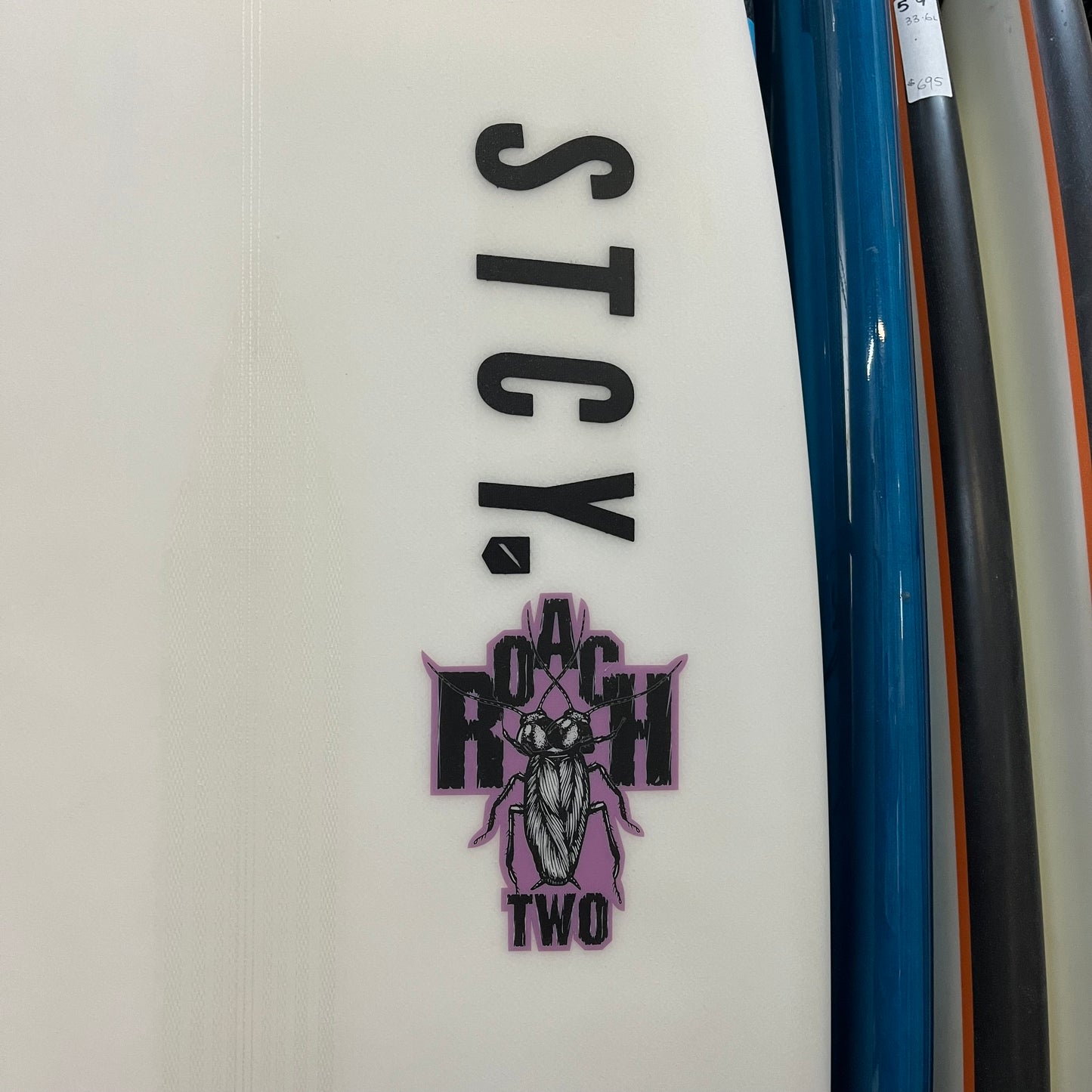 Stacey Roach 2 5'8" secondhand surfboard model logo close-up