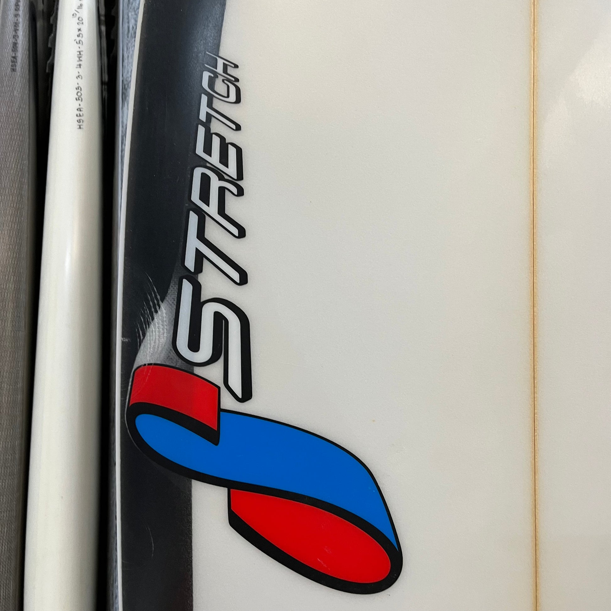 Stretch Quad Fish 5'6" secondhand surfboard brand logo close-up