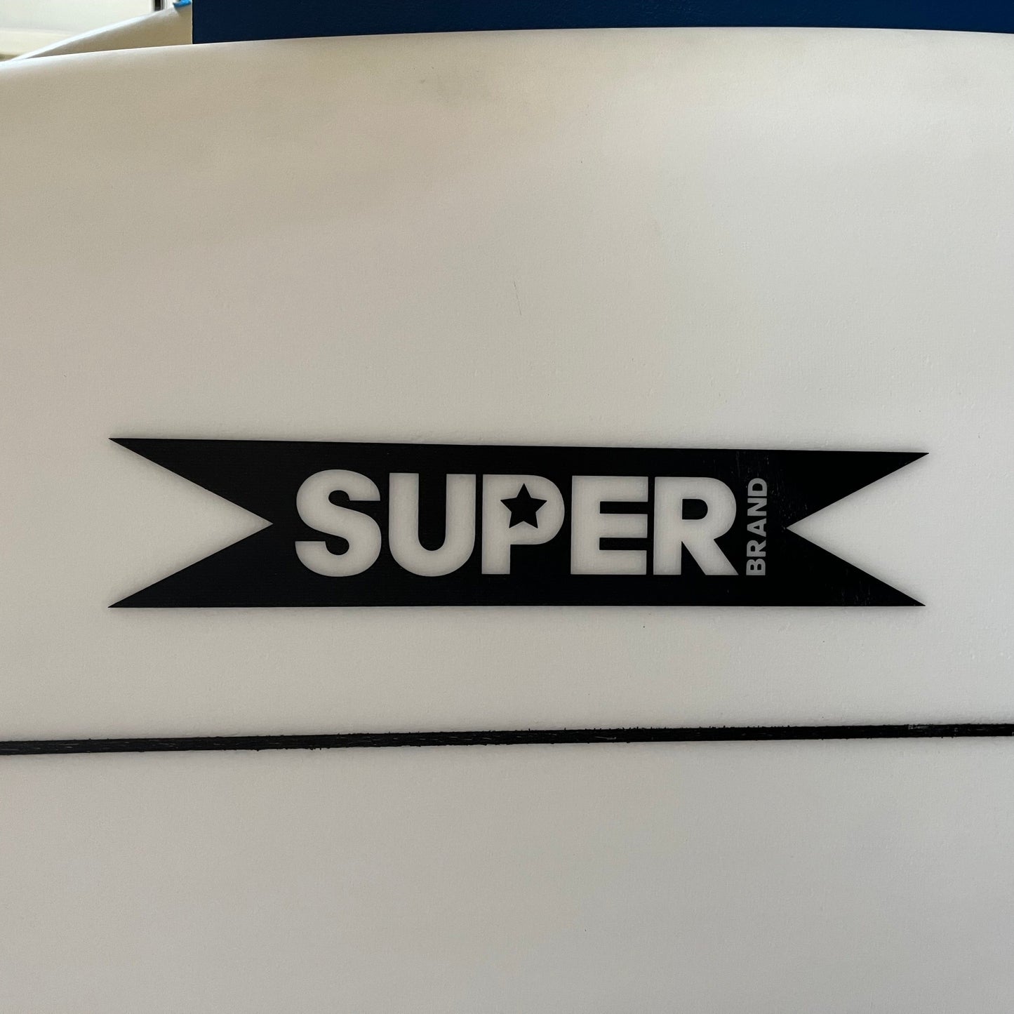 Superbrand Pig Dog 6'1" secondhand surfboard brand logo close-up