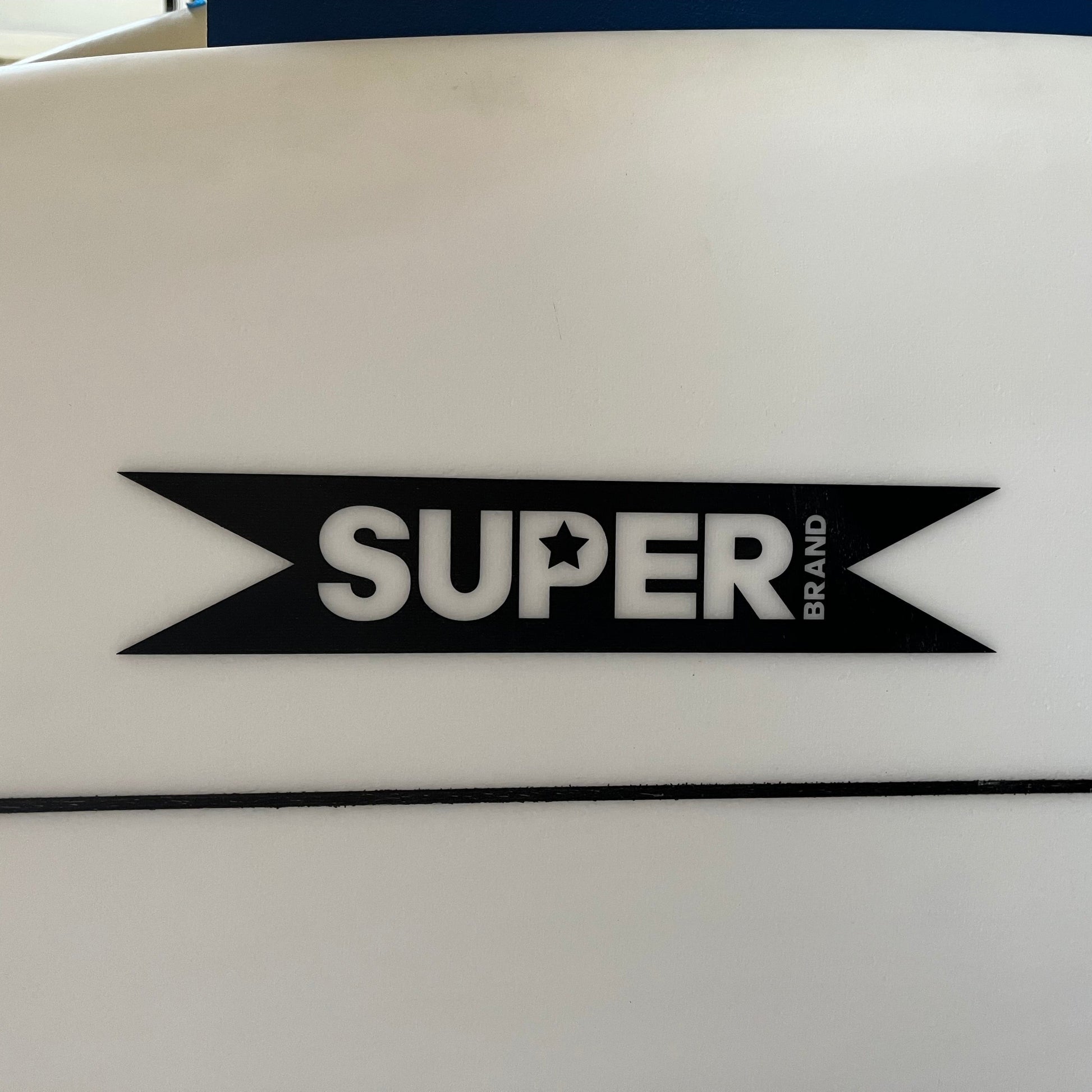 Superbrand Pig Dog 6'1" secondhand surfboard brand logo close-up