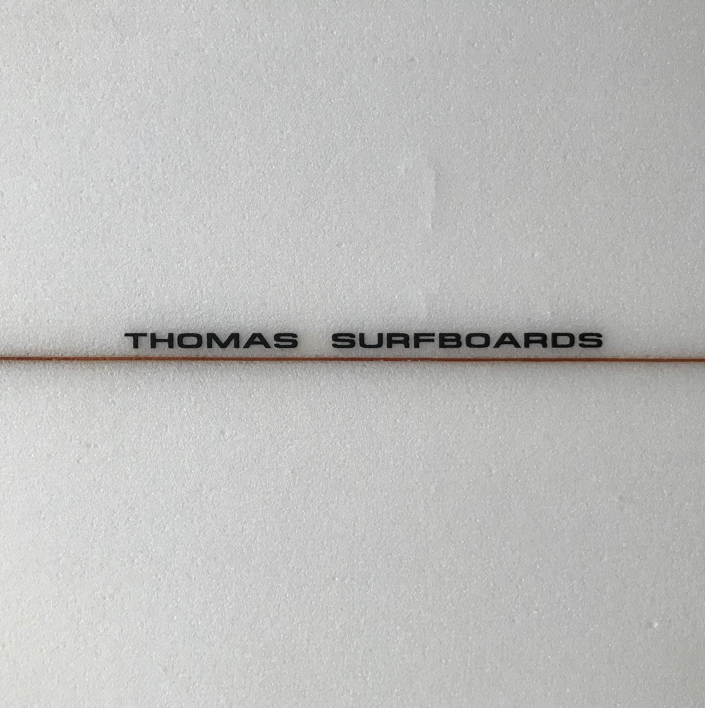 Thomas Surfboards 'Terry Fitzgerald' single fin 6'9" secondhand surfboard brand logo close-up