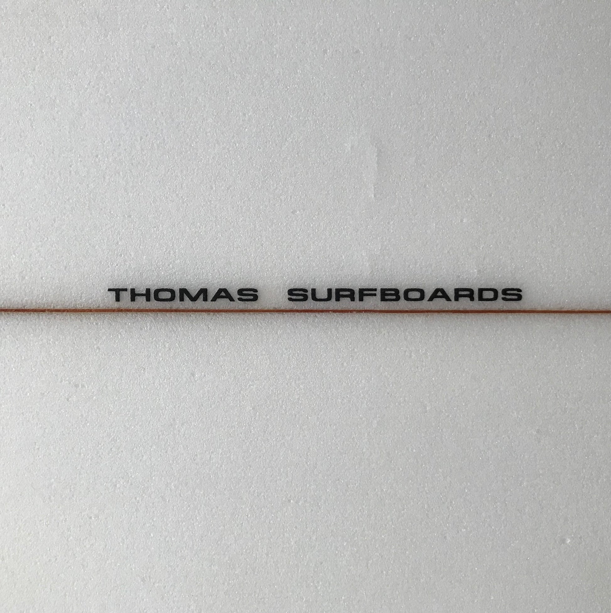 Thomas Surfboards 'Terry Fitzgerald' single fin 6'9" secondhand surfboard brand logo close-up