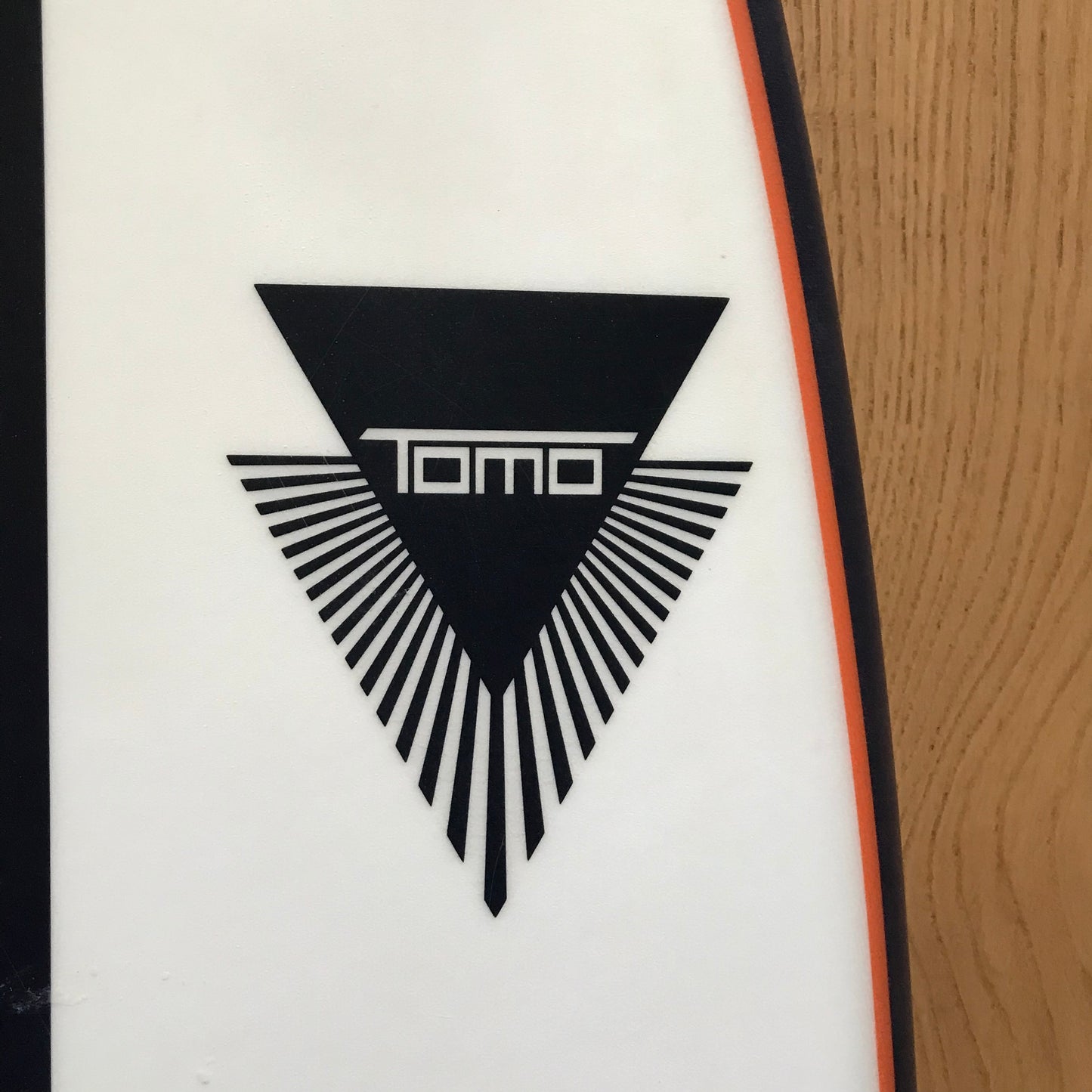 Tomo El Tomo Fish 5'9" secondhand surfboard brand logo close-up