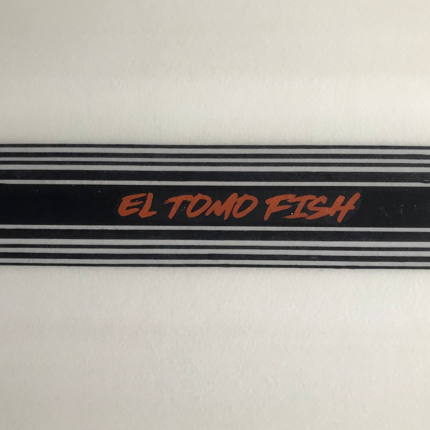 Tomo El Tomo Fish 5'9" secondhand surfboard model logo close-up