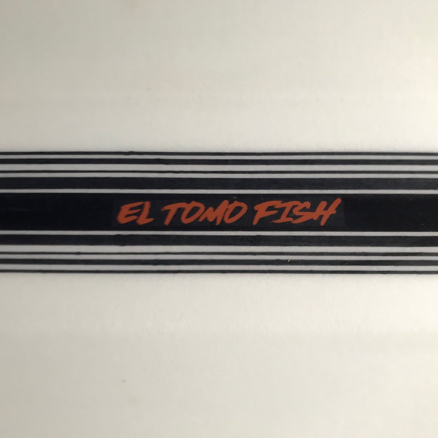 Tomo El Tomo Fish 6'0" secondhand surfboard model logo close-up