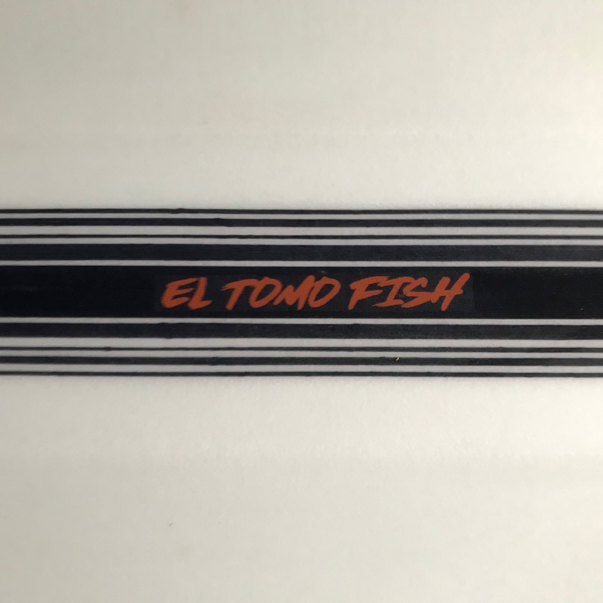Tomo El Tomo Fish 6'0" secondhand surfboard model logo close-up