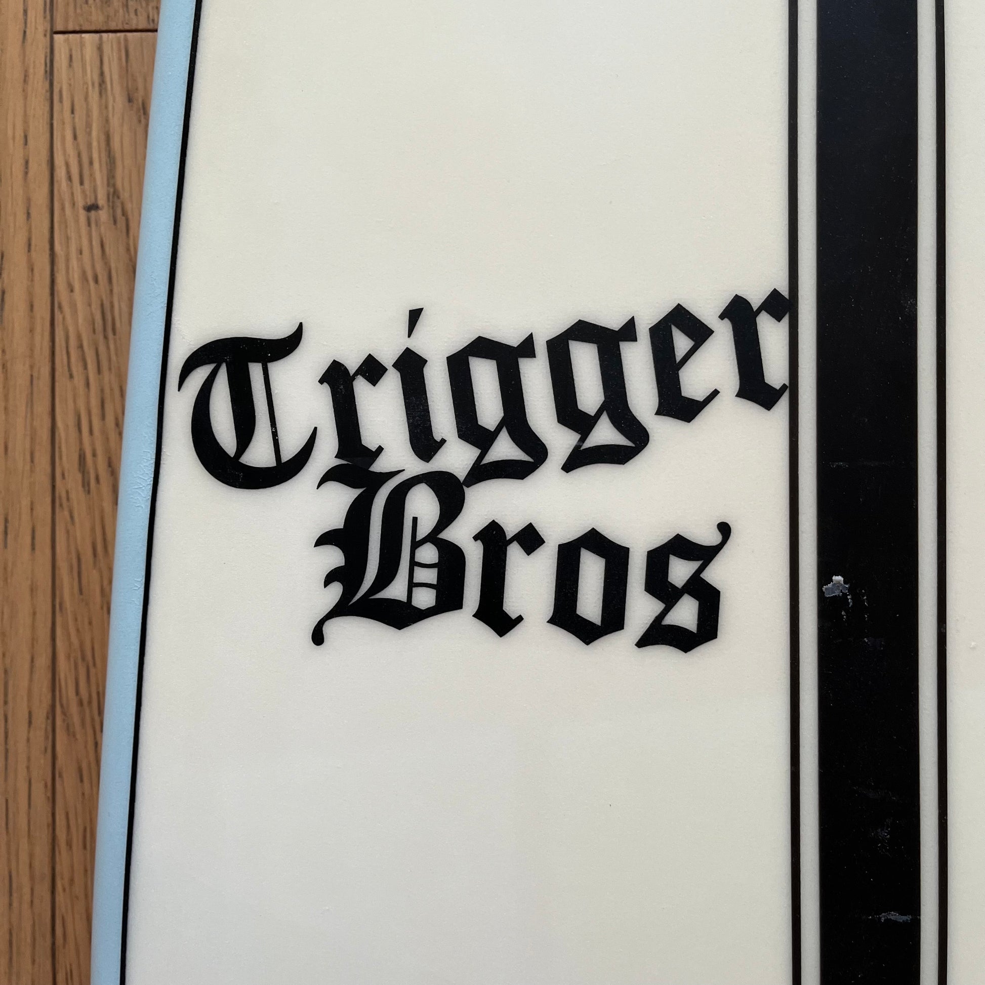 Trigger Bros The Nuke 5'8" secondhand surfboard brand logo close-up