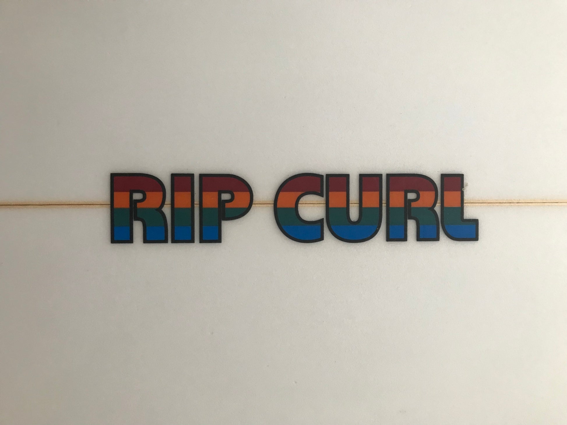 Rip Curl twin fin 5'6" secondhand surfboard brand logo close-up